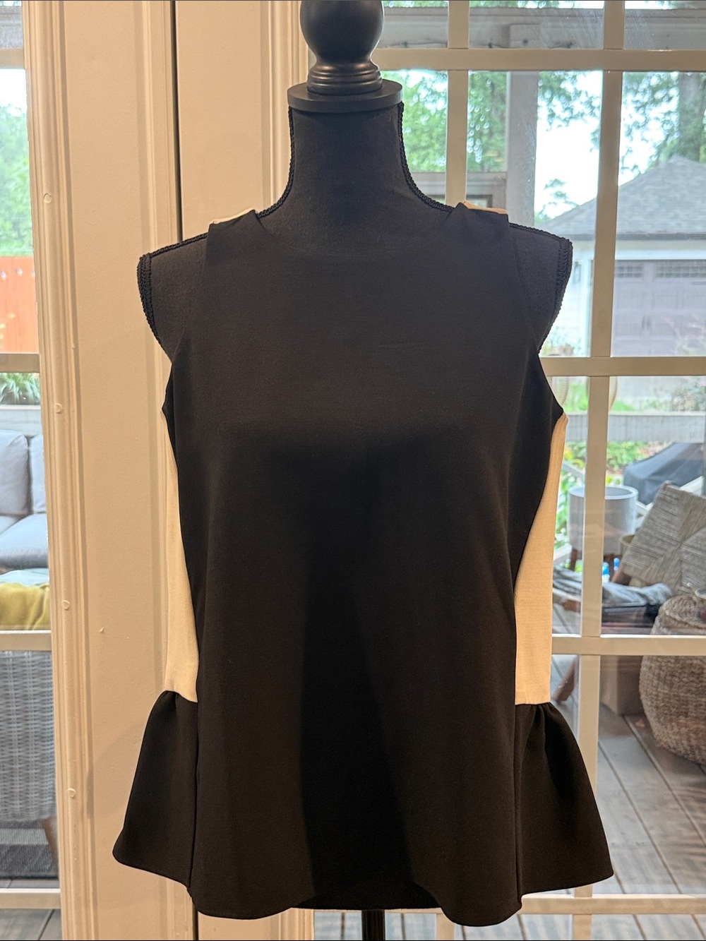 Sleeveless Black and Cream Colorblock Peplum Hem Shell